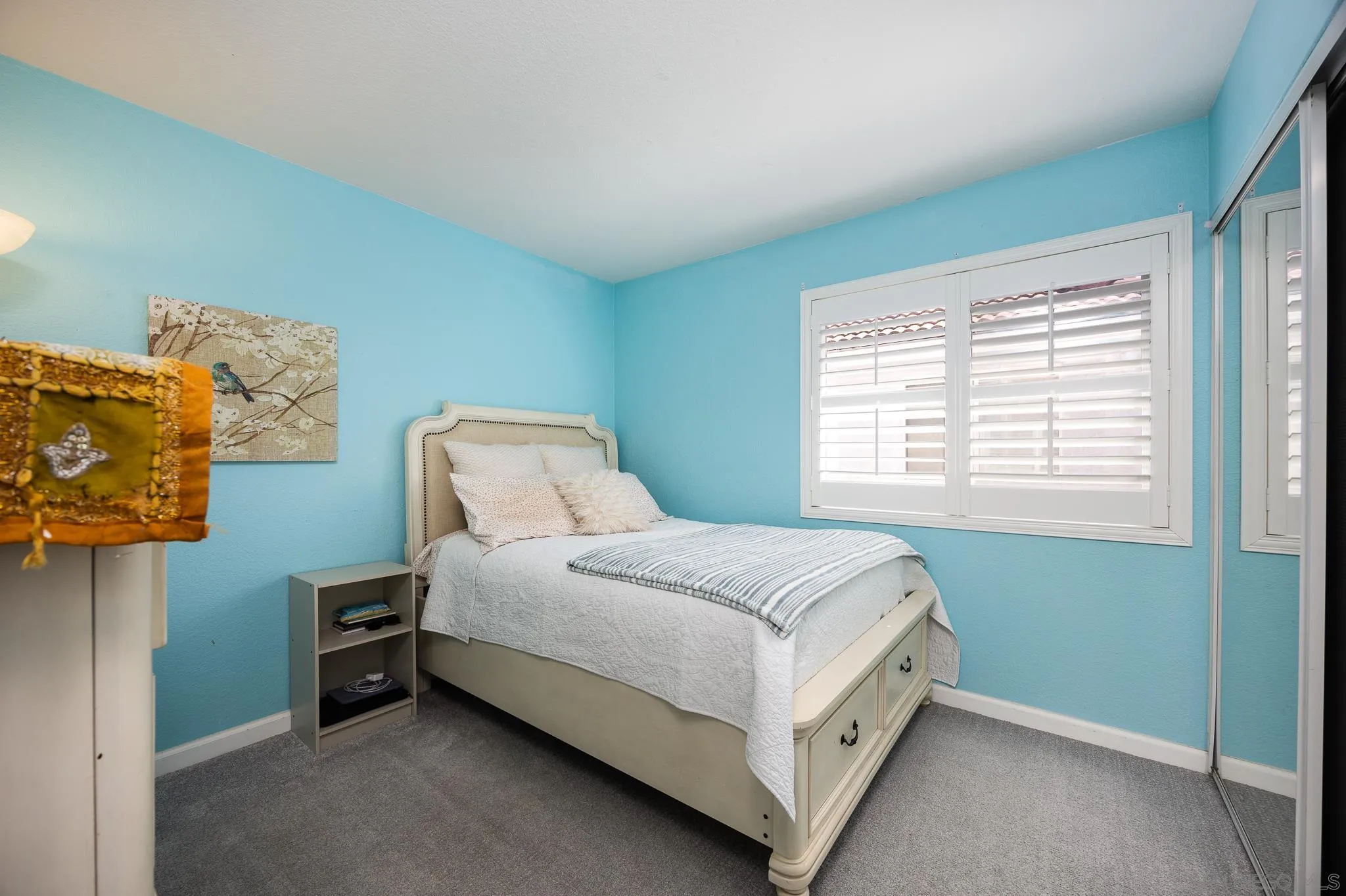 1373 Avenida Azul San Marcos, CA 92069 - Photo 19 of 33 a bed sitting in a bedroom next to a window