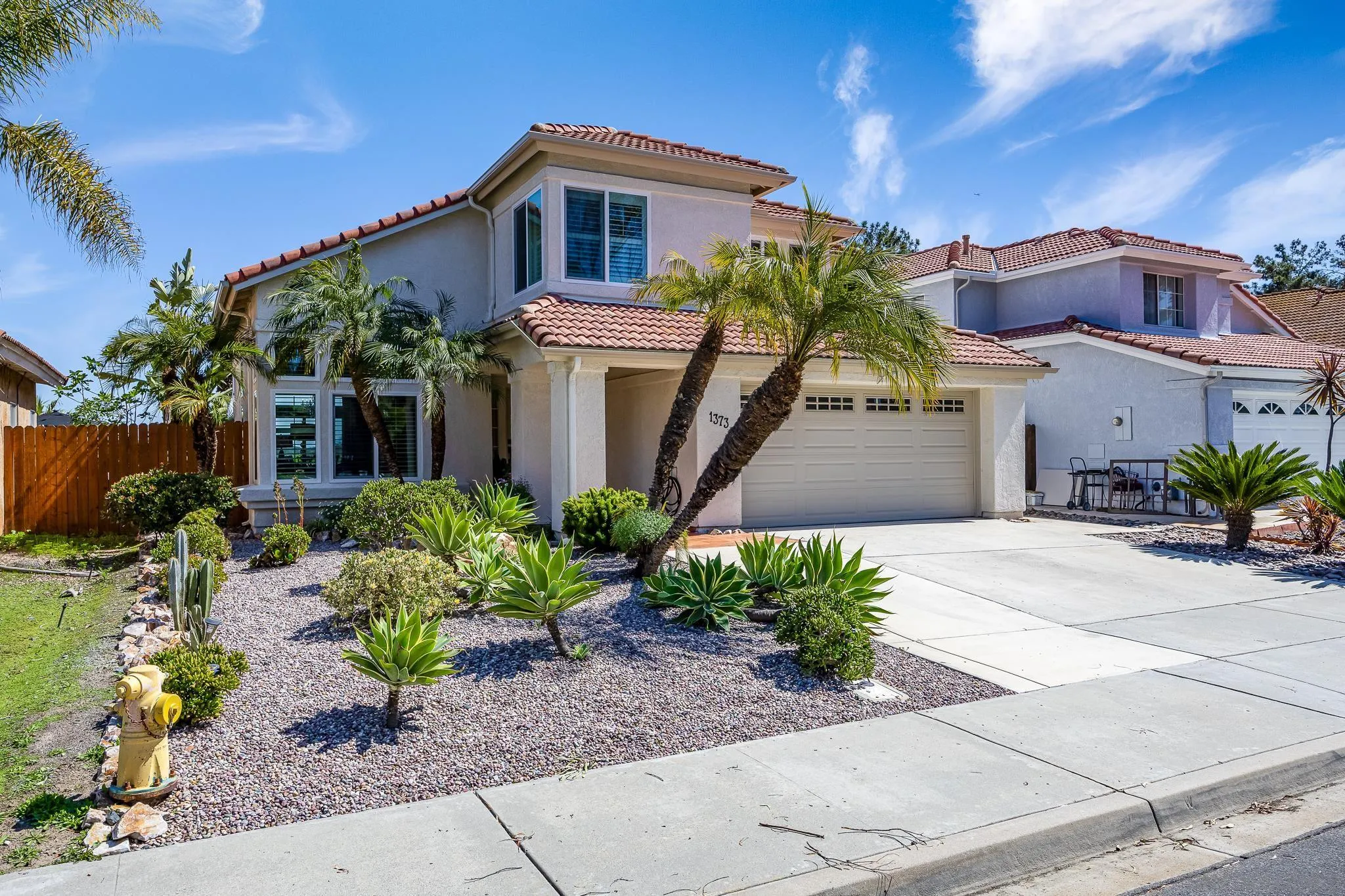 1373 Avenida Azul San Marcos, CA 92069 - Photo 2 of 33 a front view of a house with a yard