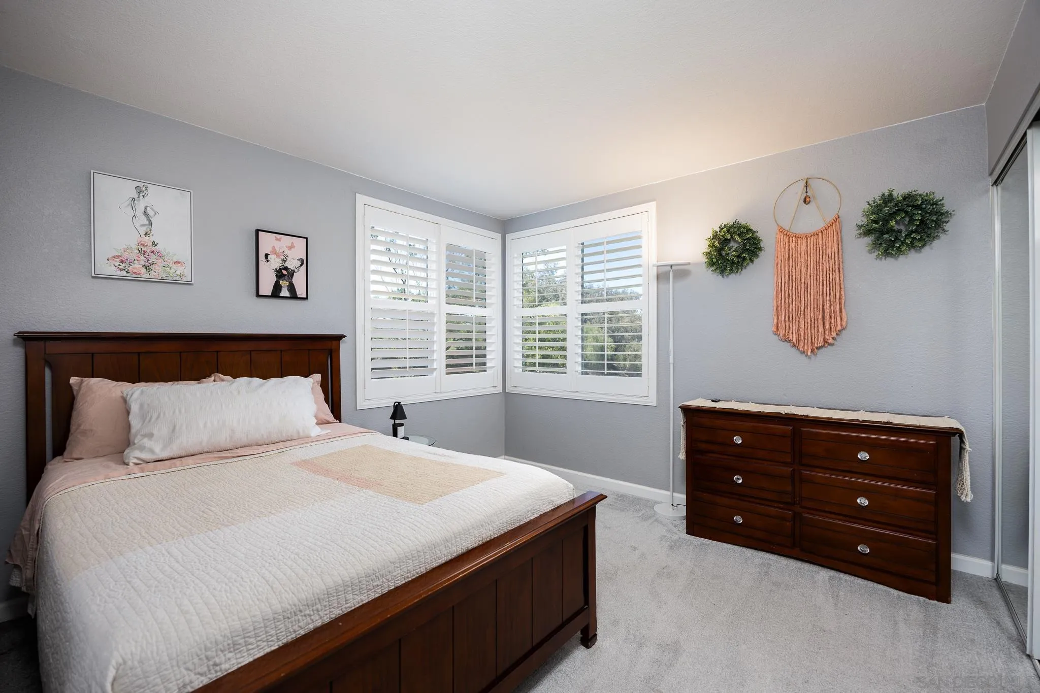 1373 Avenida Azul San Marcos, CA 92069 - Photo 22 of 33 a bedroom with a bed and a window