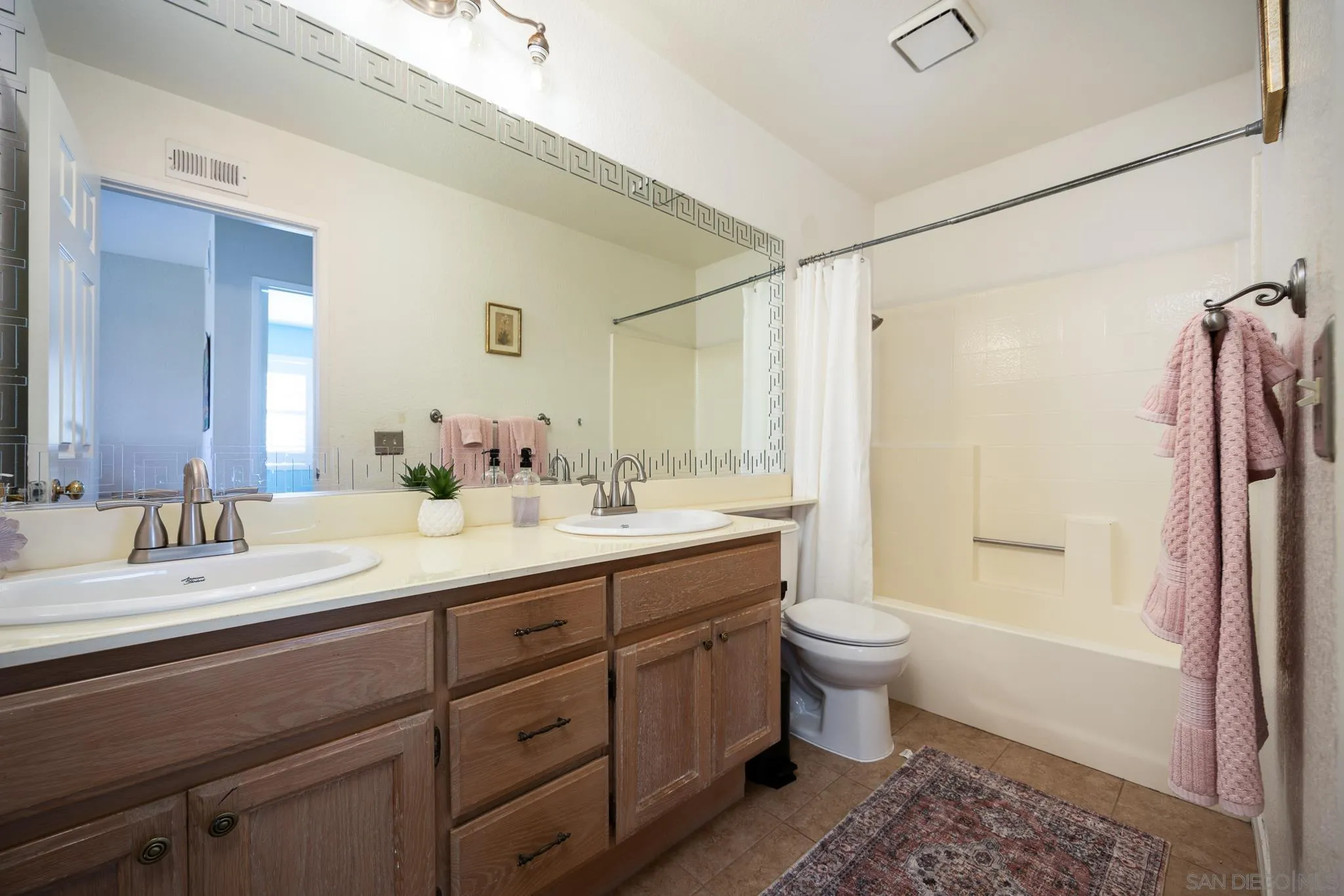 1373 Avenida Azul San Marcos, CA 92069 - Photo 24 of 33 a bathroom with a double vanity sink toilet and shower
