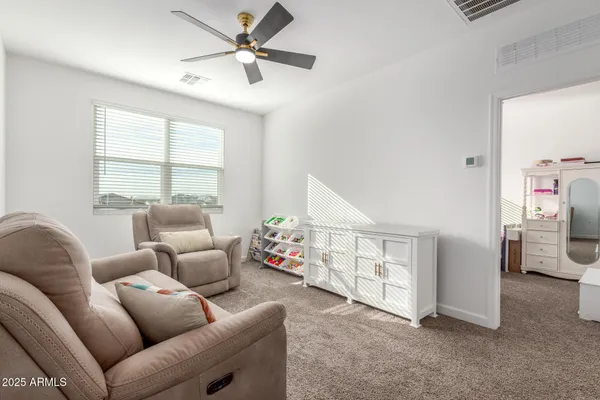 a living room with furniture and a window