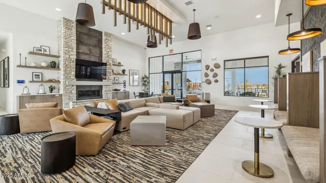 a living room with furniture kitchen view and a fireplace