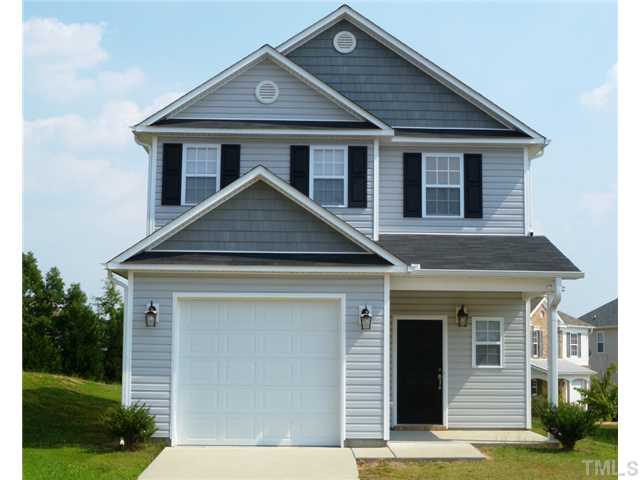 6040 Ladish Lane Raleigh, NC 27610 - Photo 1 of 21 a front view of a house with garden