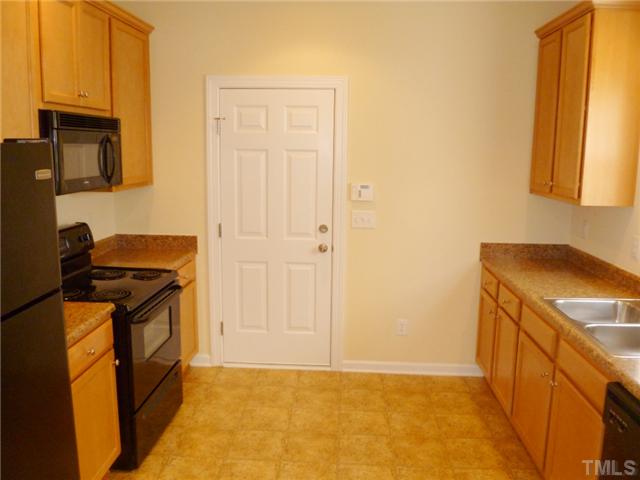 6040 Ladish Lane Raleigh, NC 27610 - Photo 13 of 21 a utility room with sink dryer and washer