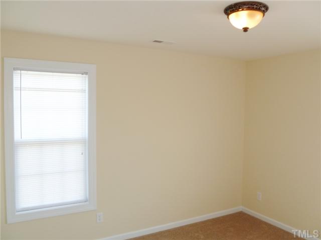 6040 Ladish Lane Raleigh, NC 27610 - Photo 18 of 21 a view of a small space with a window