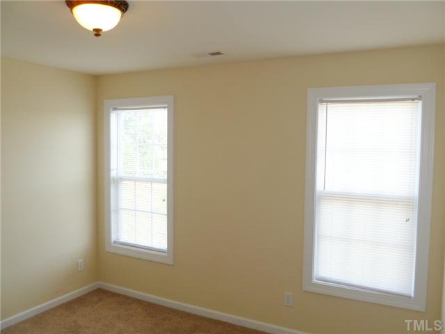 6040 Ladish Lane Raleigh, NC 27610 - Photo 19 of 21 an empty room with windows