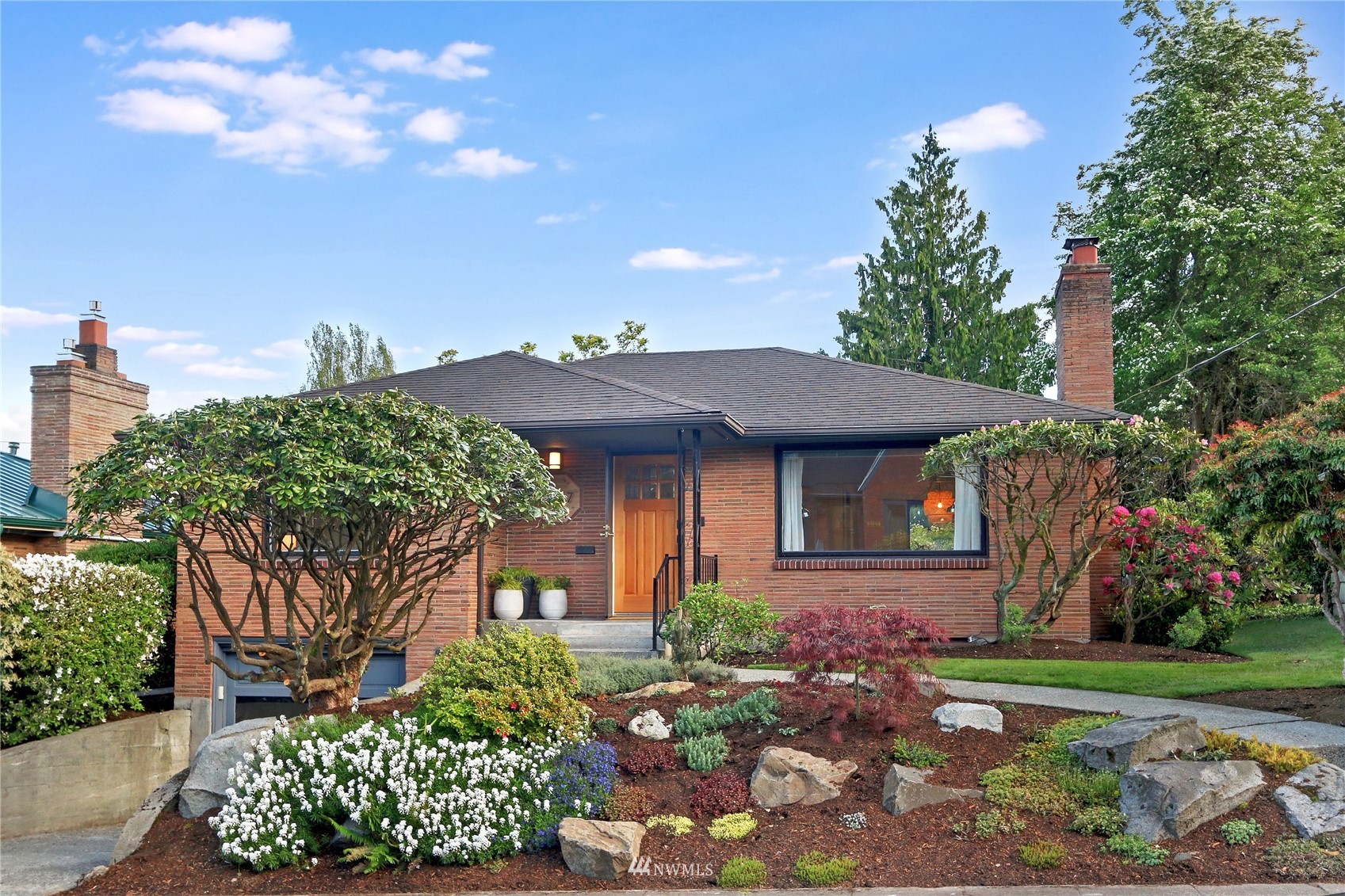 a front view of a house with garden