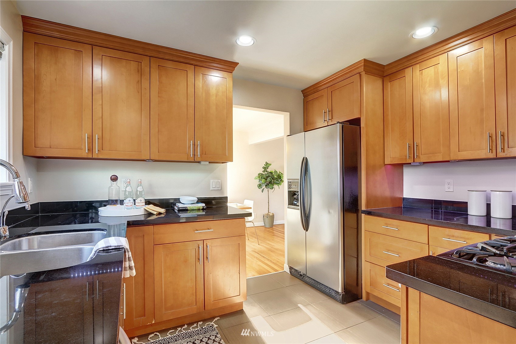 5217 South Myrtle Street Seattle, WA 98118 - Photo 11 of 30 a kitchen with stainless steel appliances granite countertop a refrigerator a stove a sink and dishwasher