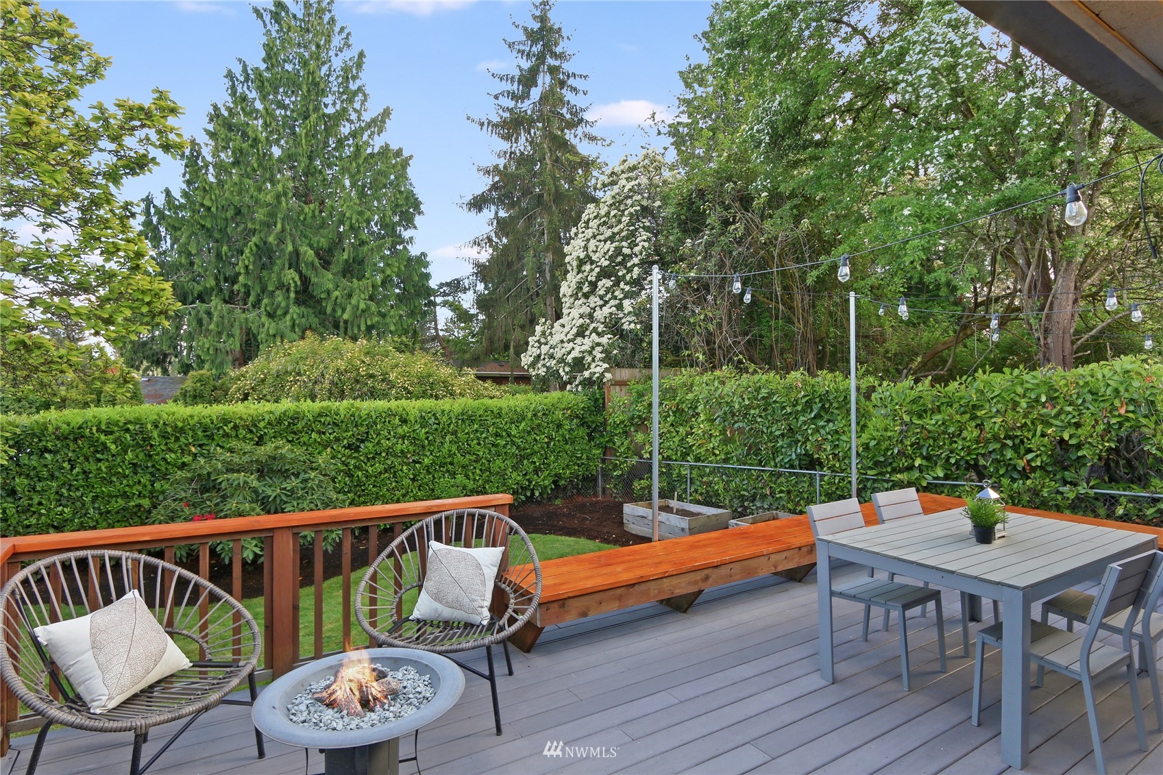 5217 South Myrtle Street Seattle, WA 98118 - Photo 14 of 30 an outdoor sitting area with furniture and wooden floor