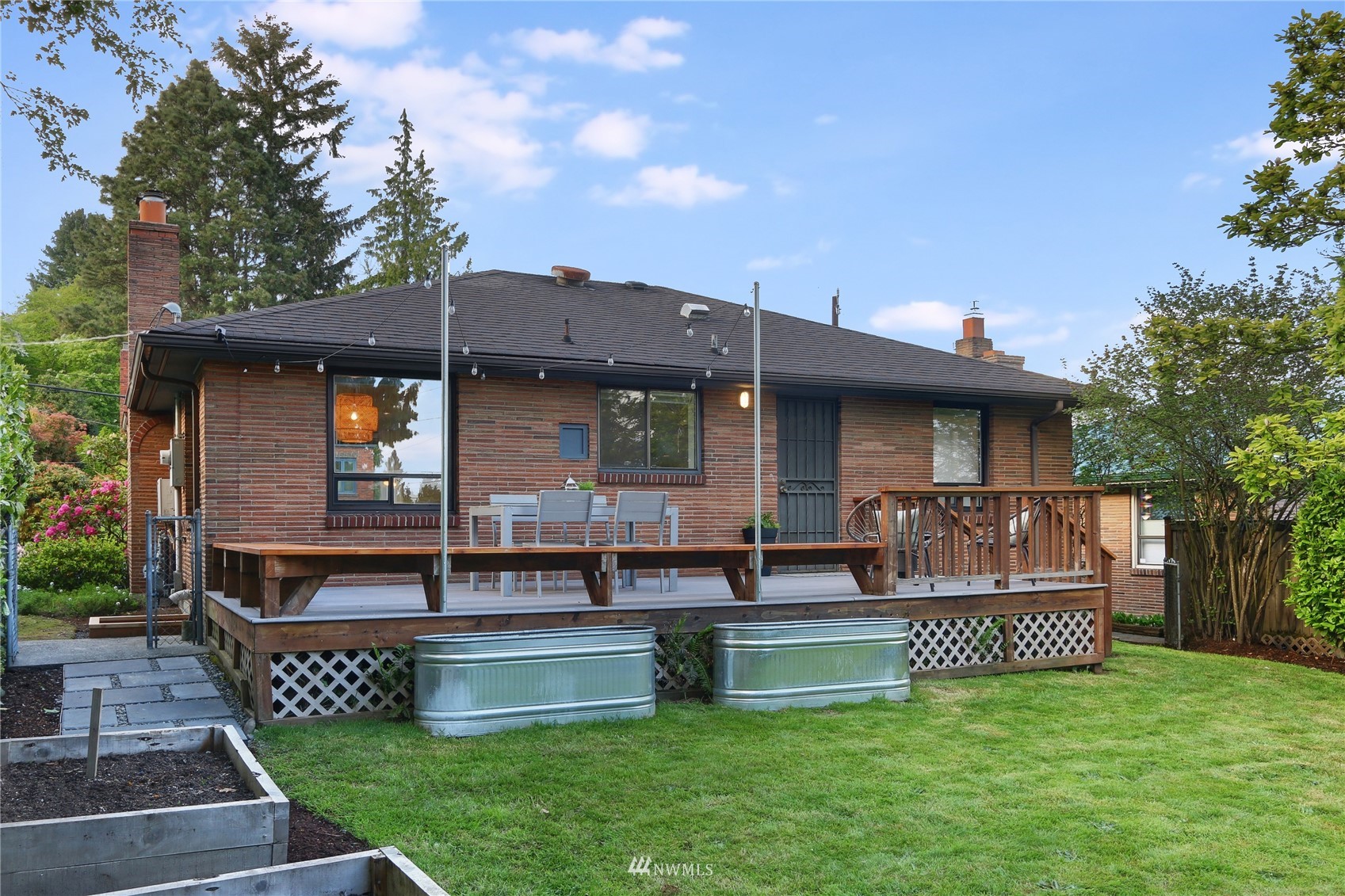 5217 South Myrtle Street Seattle, WA 98118 - Photo 16 of 30 a front view of house with deck and outdoor seating