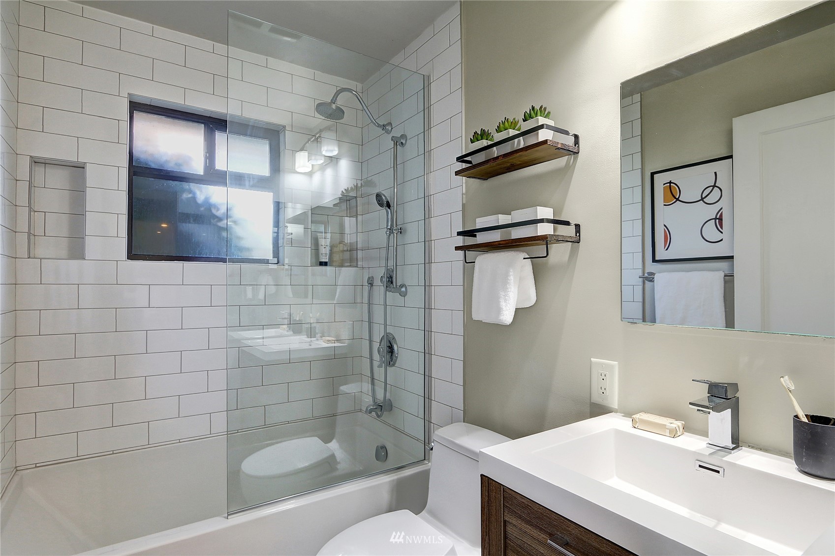 5217 South Myrtle Street Seattle, WA 98118 - Photo 19 of 30 a bathroom with a sink a toilet and shower