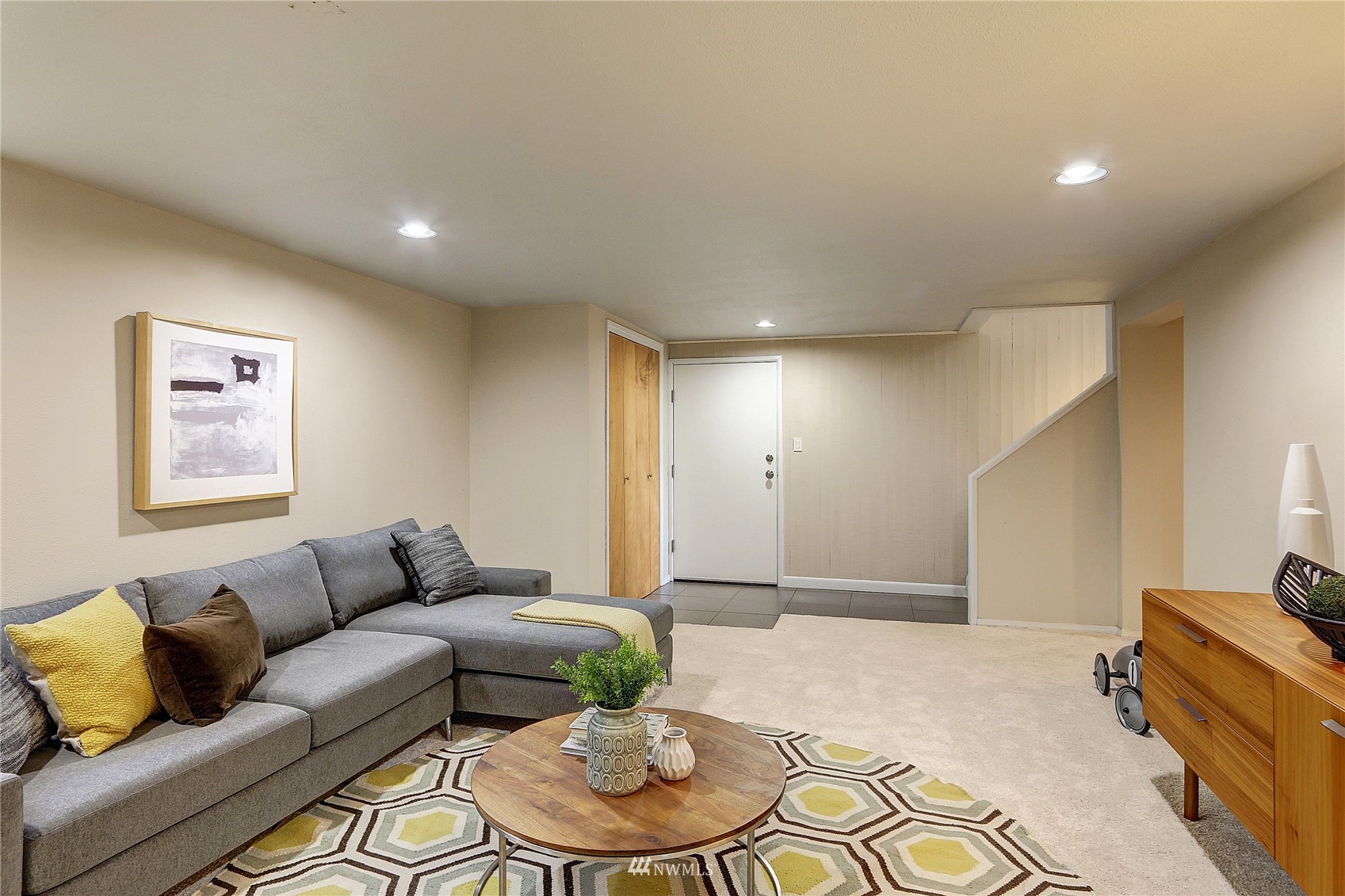 5217 South Myrtle Street Seattle, WA 98118 - Photo 22 of 30 a living room with furniture and a wooden floor
