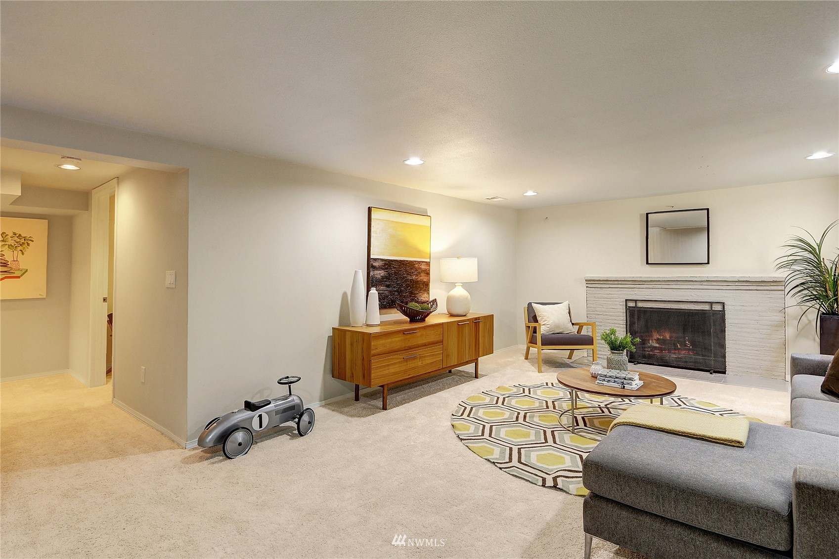 5217 South Myrtle Street Seattle, WA 98118 - Photo 24 of 30 a living room with furniture and a fireplace