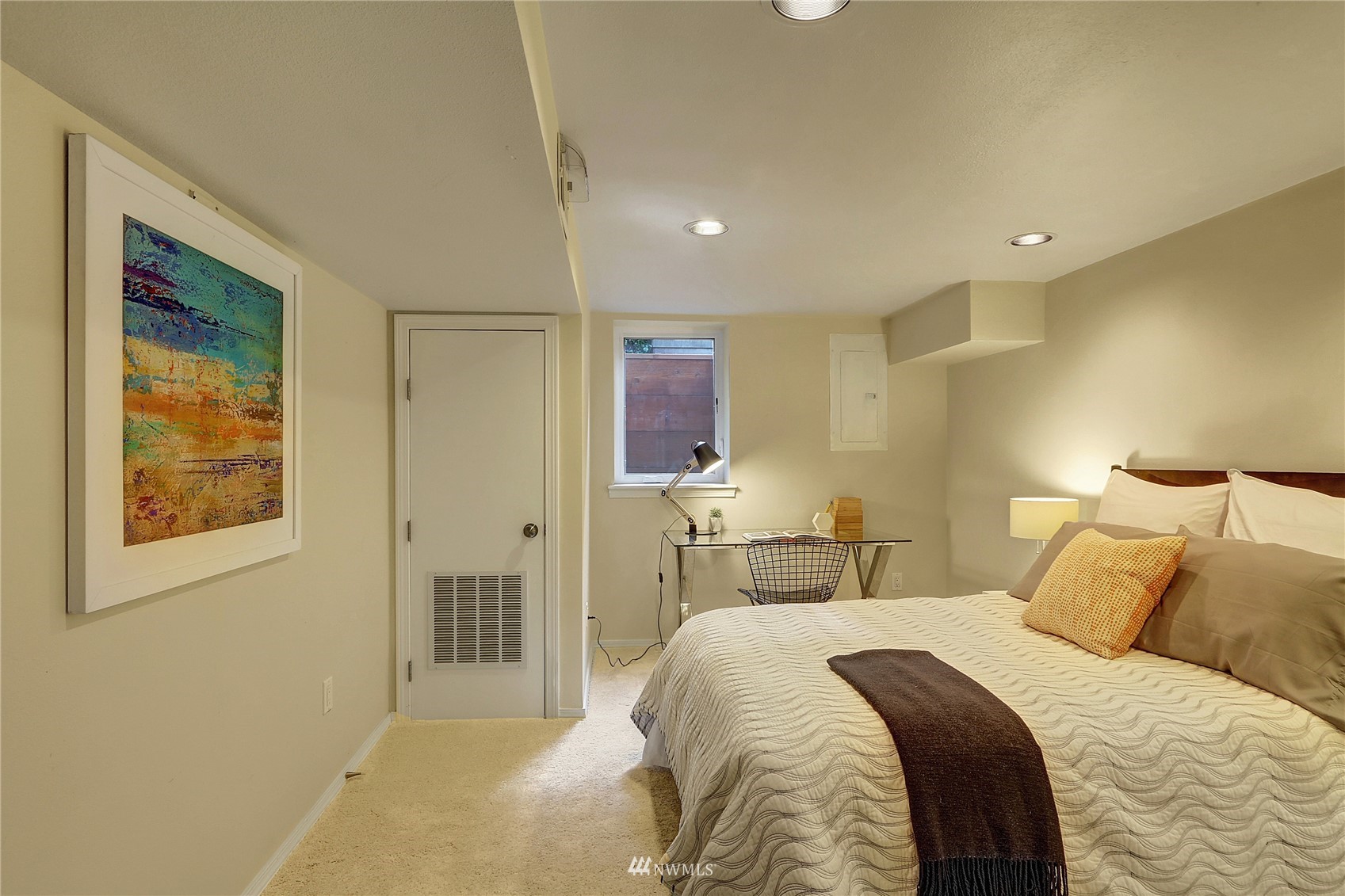 5217 South Myrtle Street Seattle, WA 98118 - Photo 25 of 30 a bedroom with a bed and a painting