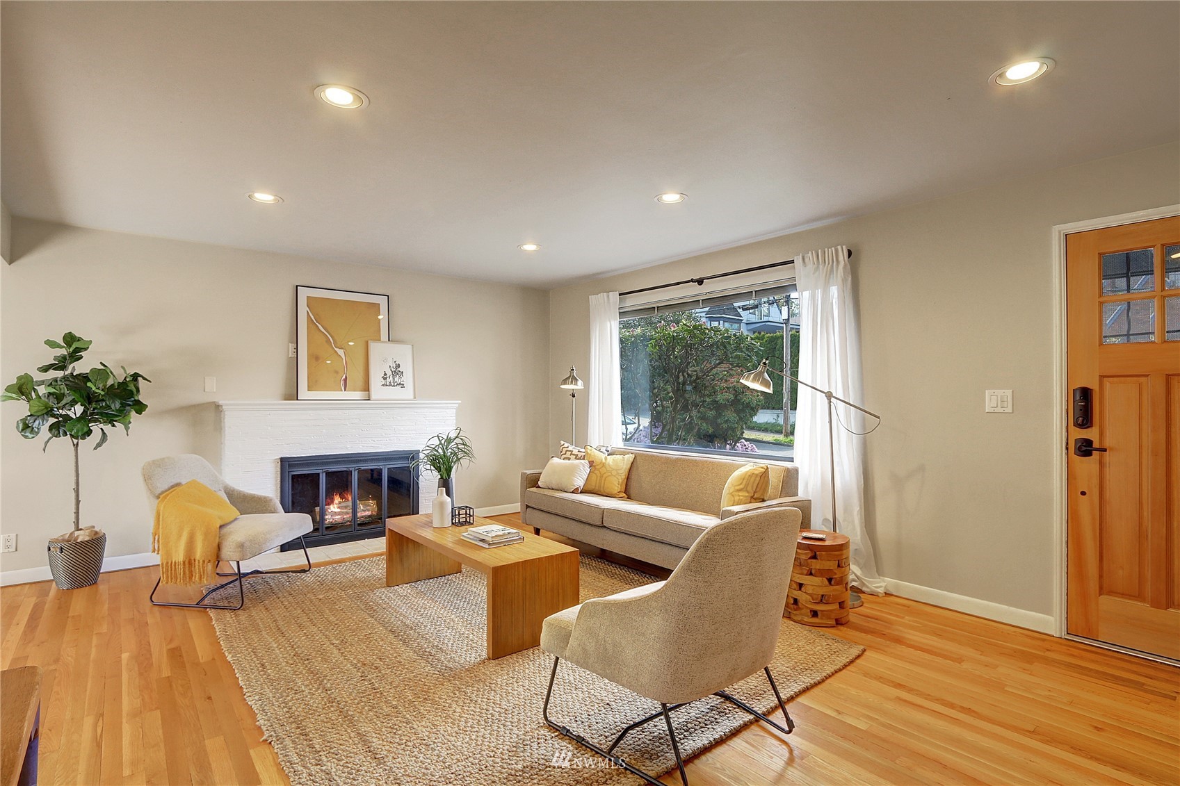 5217 South Myrtle Street Seattle, WA 98118 - Photo 5 of 30 a living room with furniture and a fireplace