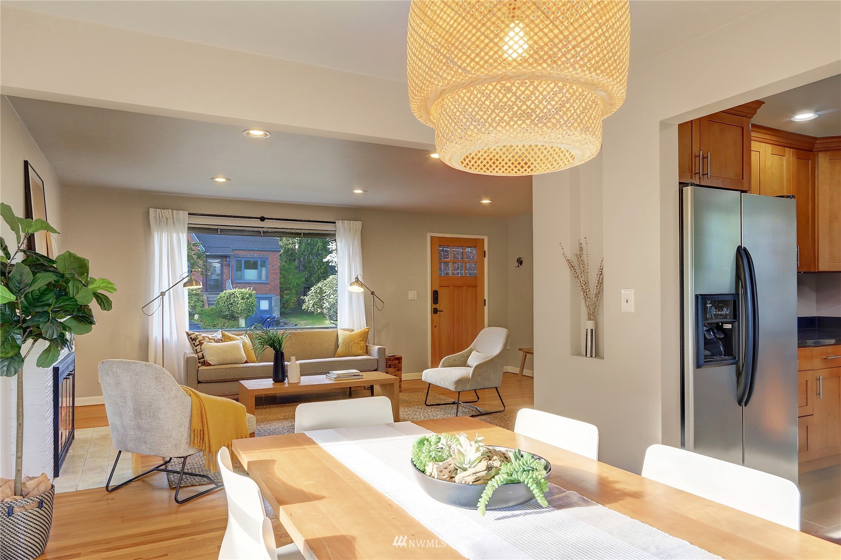 5217 South Myrtle Street Seattle, WA 98118 - Photo 10 of 30 a living room with furniture and a chandelier