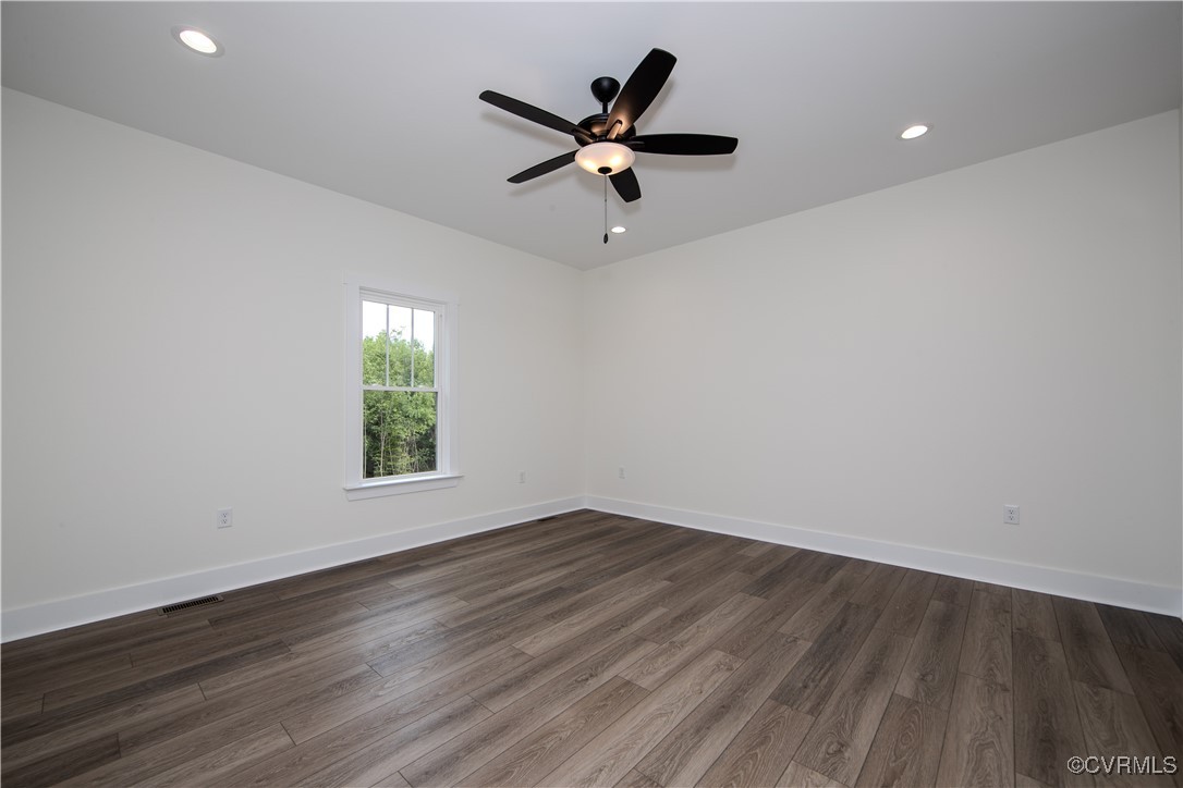 10500 Cross County Road Mineral, VA 23117 - Photo 14 of 27 an empty room with wooden floor and windows