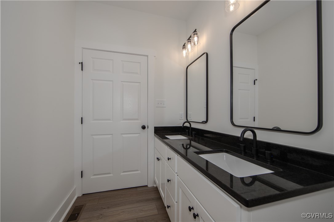 10500 Cross County Road Mineral, VA 23117 - Photo 18 of 27 a bathroom with double vanity and a mirror
