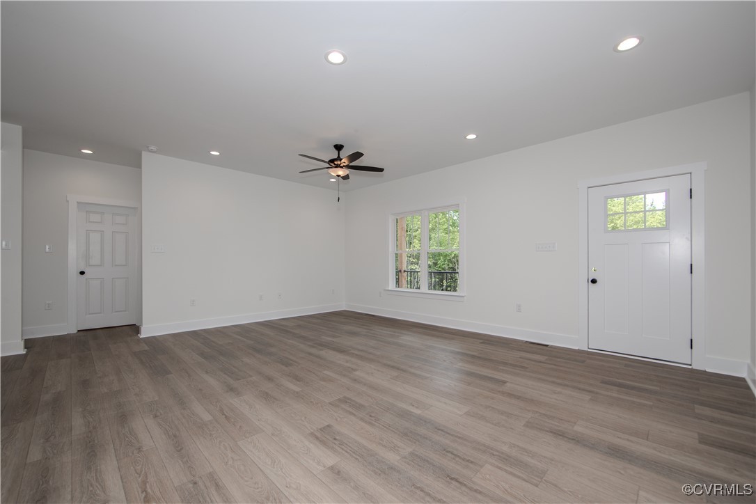 10500 Cross County Road Mineral, VA 23117 - Photo 8 of 27 an empty room with wooden floor and windows