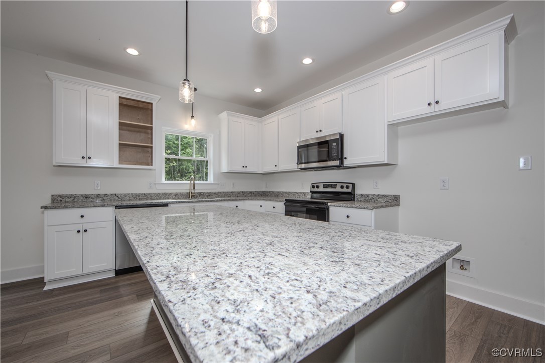 10500 Cross County Road Mineral, VA 23117 - Photo 10 of 27 a kitchen with wooden cabinets a sink and a stove