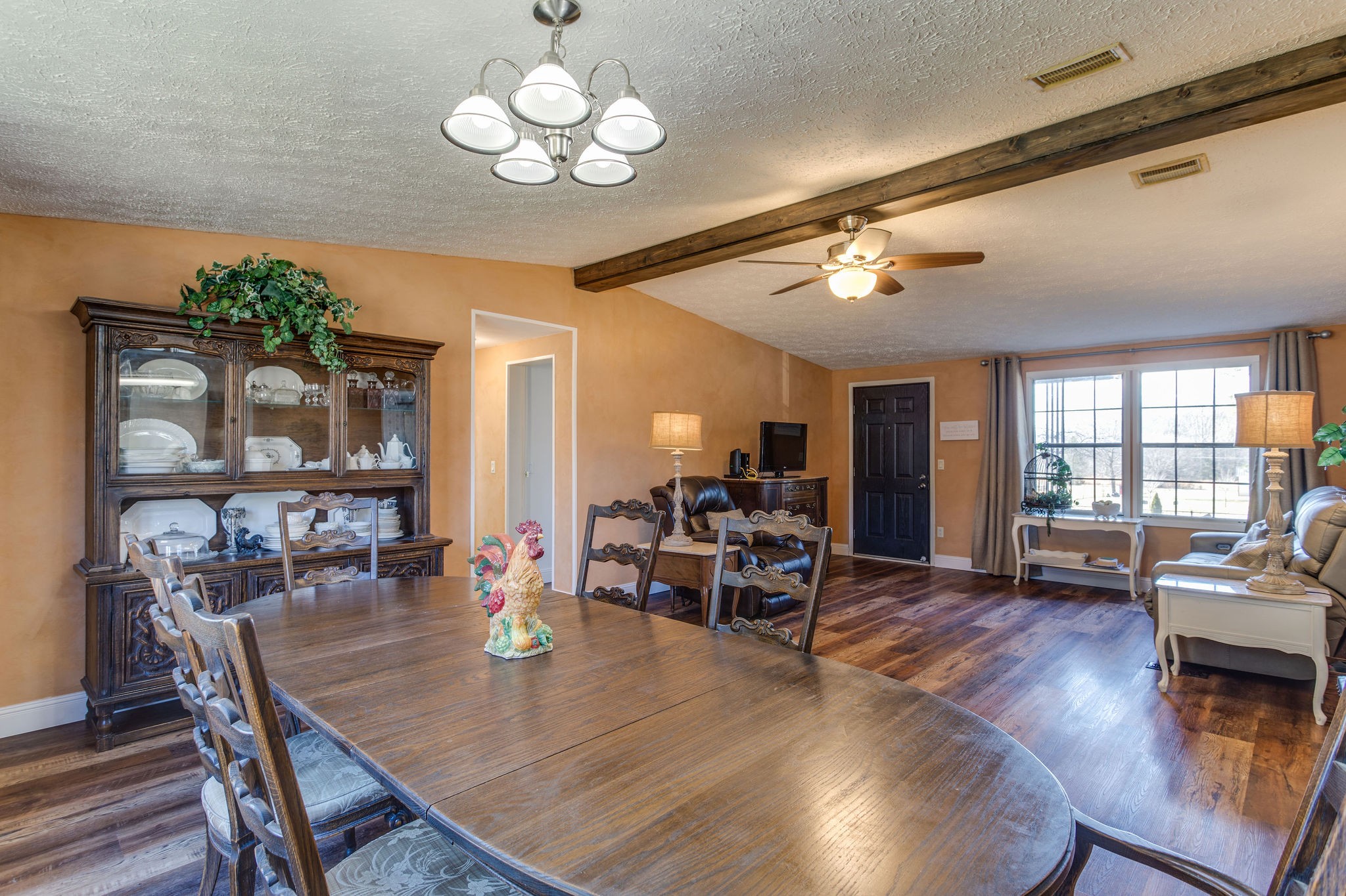 148 Stacy Road Manchester, TN 37355 - Photo 17 of 57 a view of a dining room with furniture wooden floor and chandelier