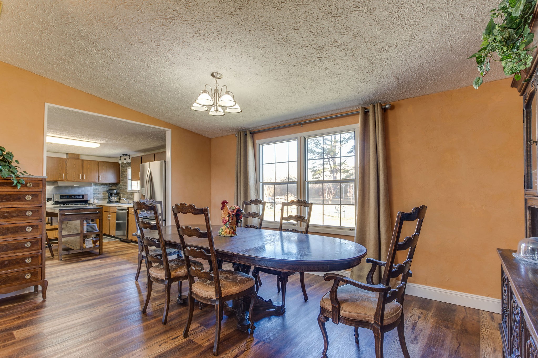148 Stacy Road Manchester, TN 37355 - Photo 19 of 57 a view of a dining room with furniture and wooden floor
