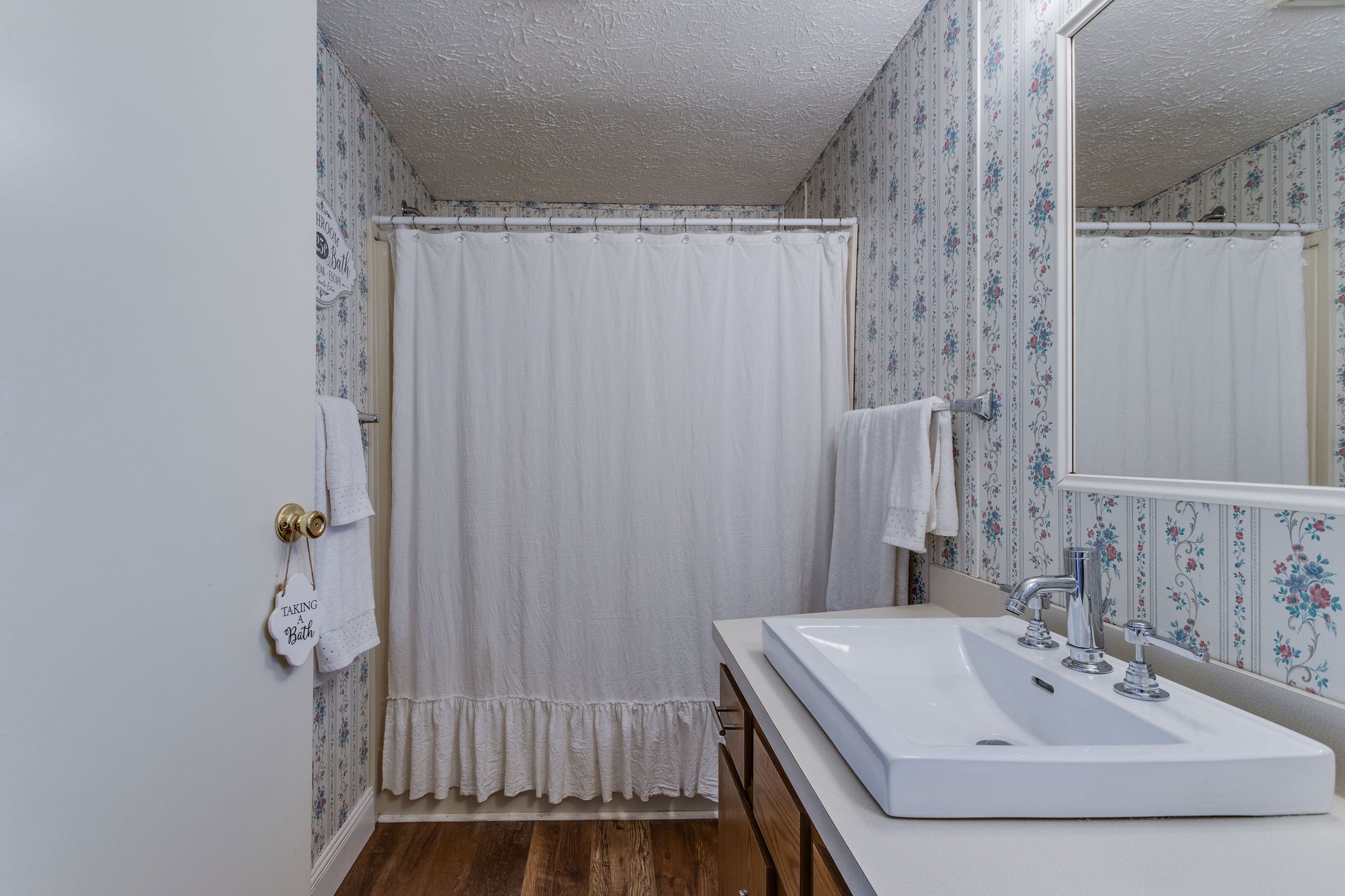 148 Stacy Road Manchester, TN 37355 - Photo 36 of 57 a bathroom with a sink a mirror and shower