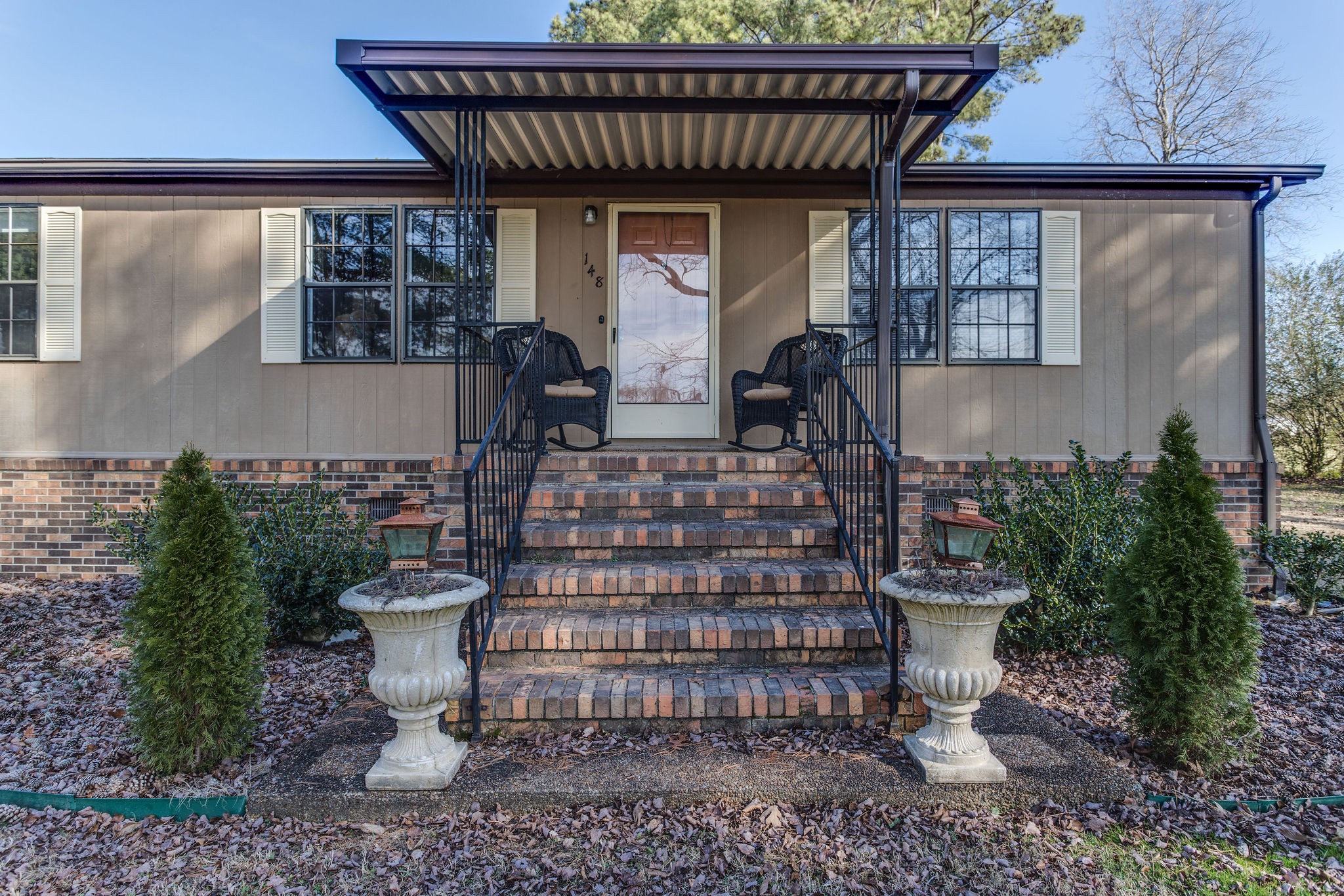 148 Stacy Road Manchester, TN 37355 - Photo 5 of 57 a view of a balcony with chairs and potted plants