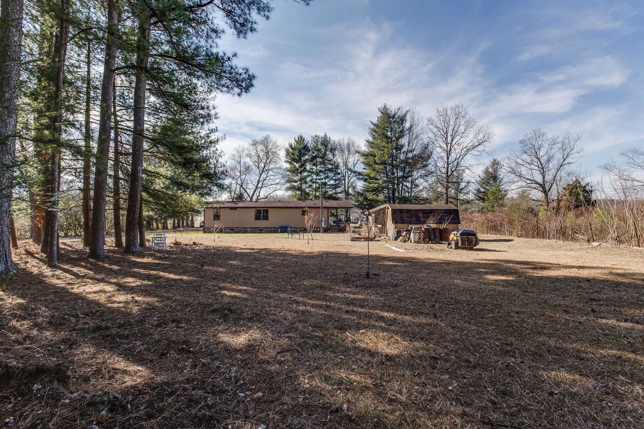 148 Stacy Road Manchester, TN 37355 - Photo 56 of 57 a front view of a house with a yard and a large tree