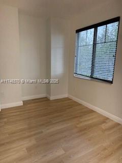 553 North West 39th Circle Boca Raton, FL 33431 - Photo 11 of 25 a view of a room with wooden floor and a window