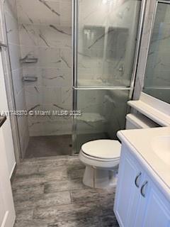 553 North West 39th Circle Boca Raton, FL 33431 - Photo 14 of 25 a bathroom with a toilet and a shower