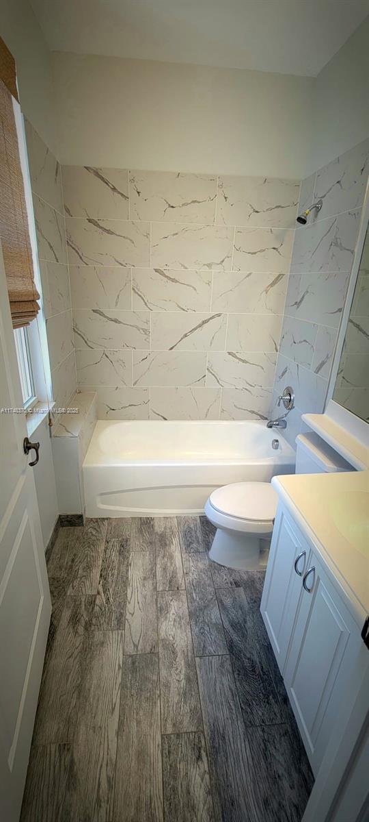 553 North West 39th Circle Boca Raton, FL 33431 - Photo 16 of 25 a bathroom with a bathtub and shower