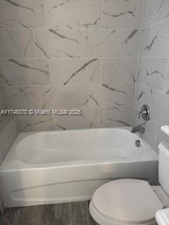 553 North West 39th Circle Boca Raton, FL 33431 - Photo 17 of 25 a bathroom with a toilet and bathtub