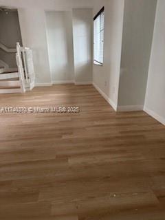 553 North West 39th Circle Boca Raton, FL 33431 - Photo 19 of 25 a view of room with window and wooden floor