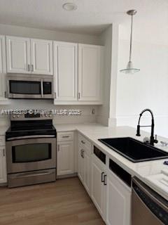 553 North West 39th Circle Boca Raton, FL 33431 - Photo 2 of 25 a kitchen with granite countertop a stove and a microwave