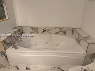 553 North West 39th Circle Boca Raton, FL 33431 - Photo 4 of 25 a bathroom with a bathtub