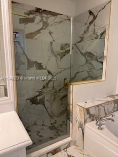 553 North West 39th Circle Boca Raton, FL 33431 - Photo 6 of 25 a bathroom with a shower and a sink