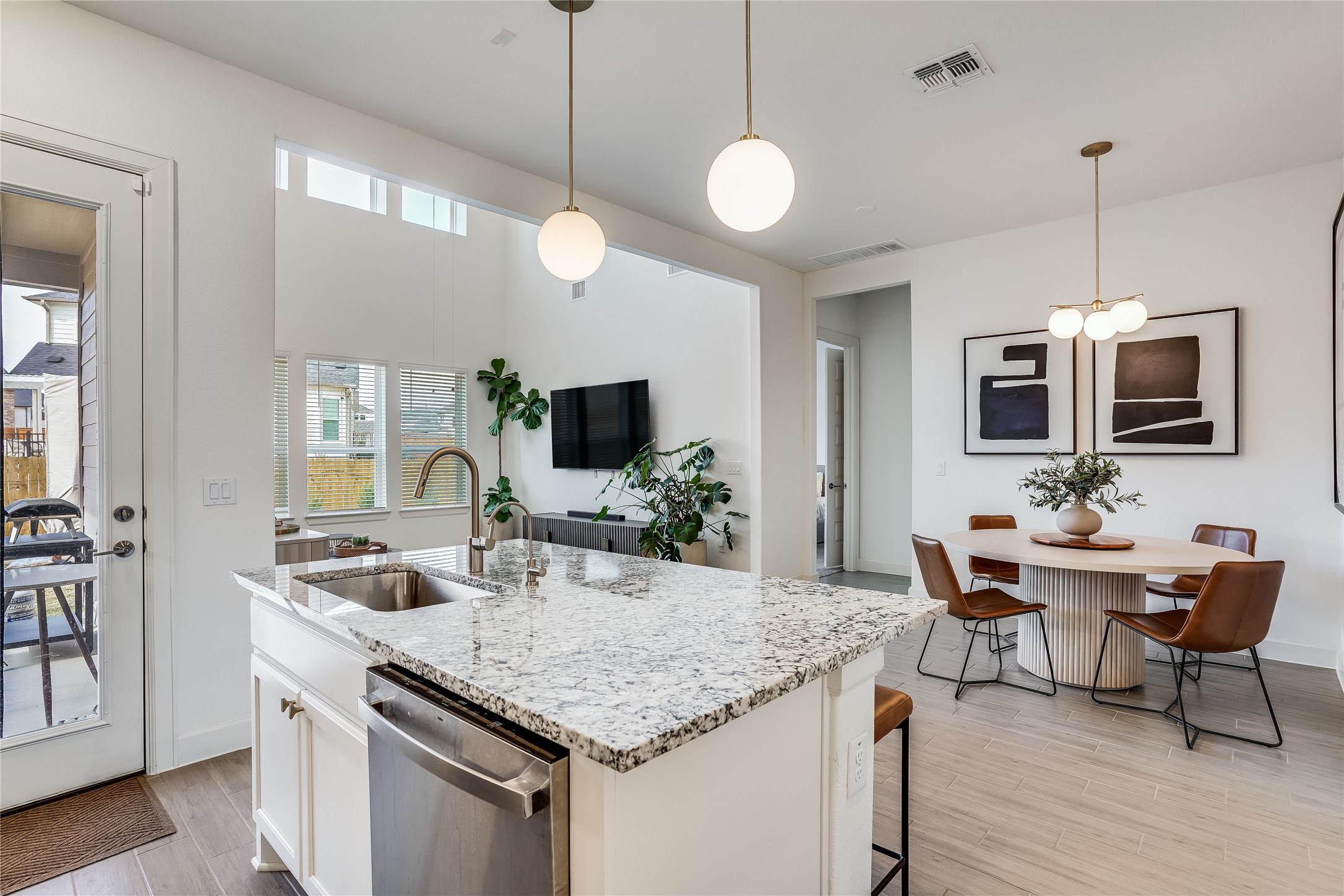 4701 Sea Salt Drive Austin, TX 78747 - Photo 12 of 29 a kitchen with granite countertop stainless steel appliances a sink and microwave