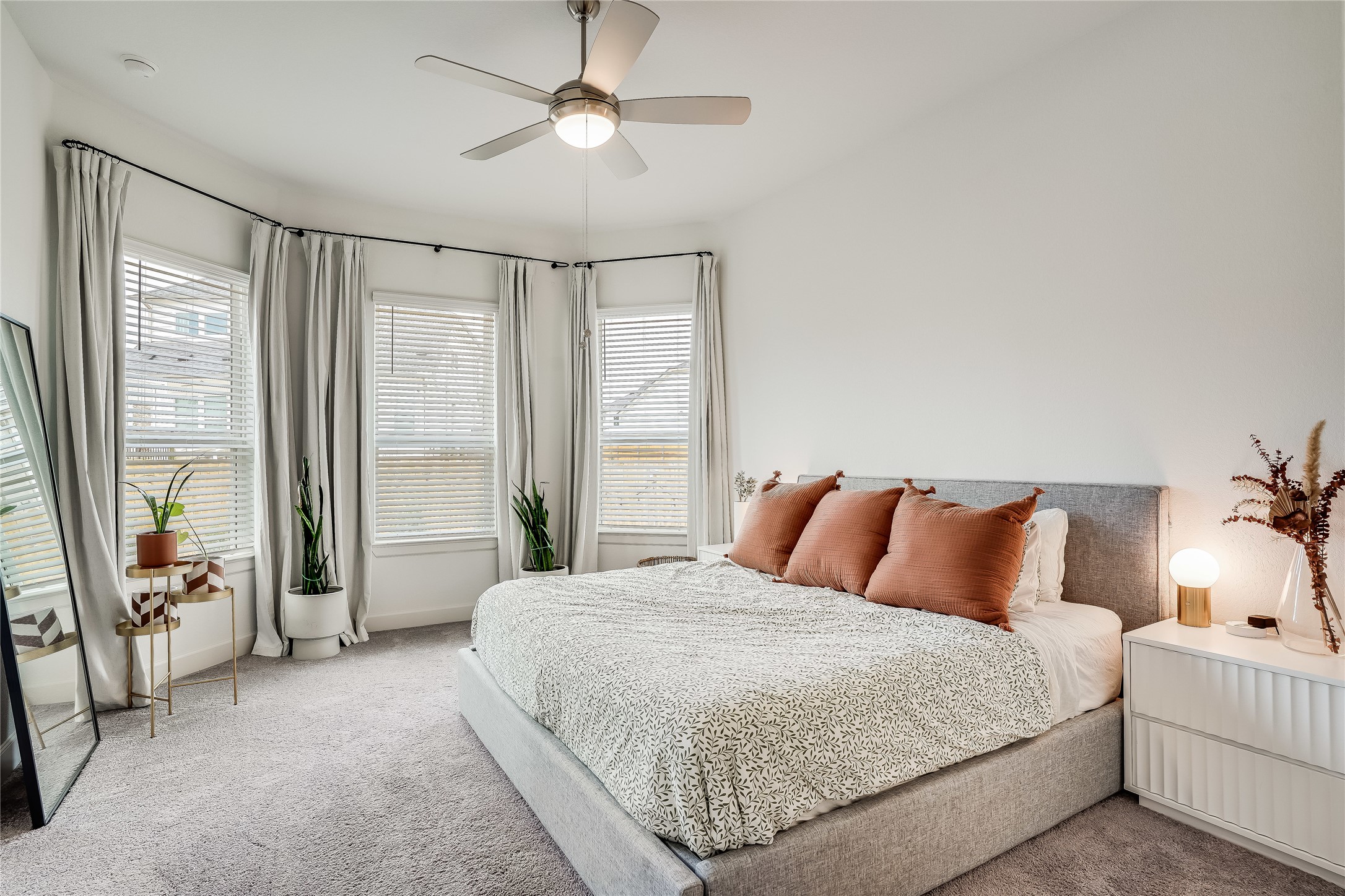 4701 Sea Salt Drive Austin, TX 78747 - Photo 14 of 29 a bedroom with a large bed and a large window