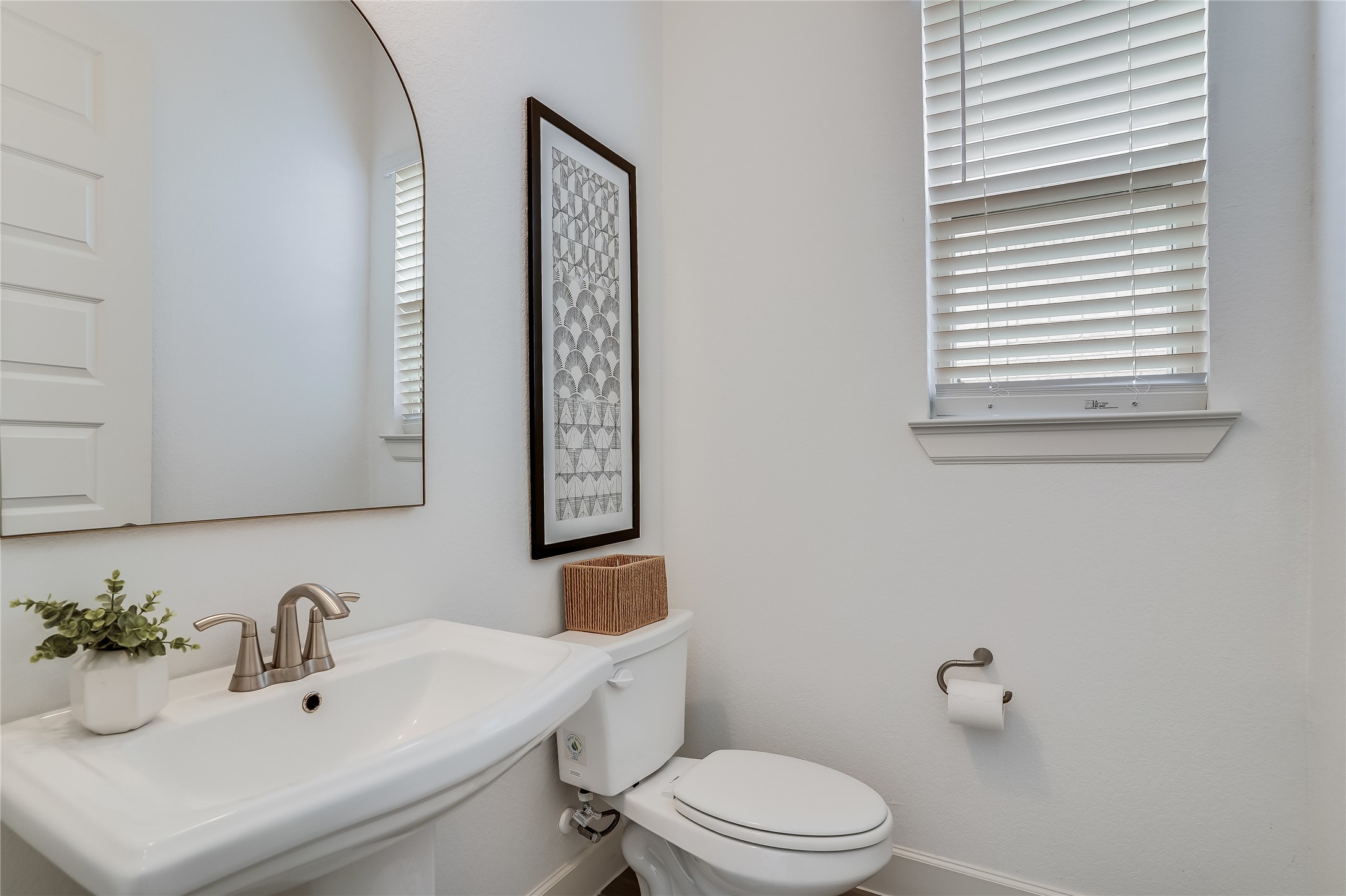 4701 Sea Salt Drive Austin, TX 78747 - Photo 25 of 29 a bathroom with a sink a mirror and a toilet
