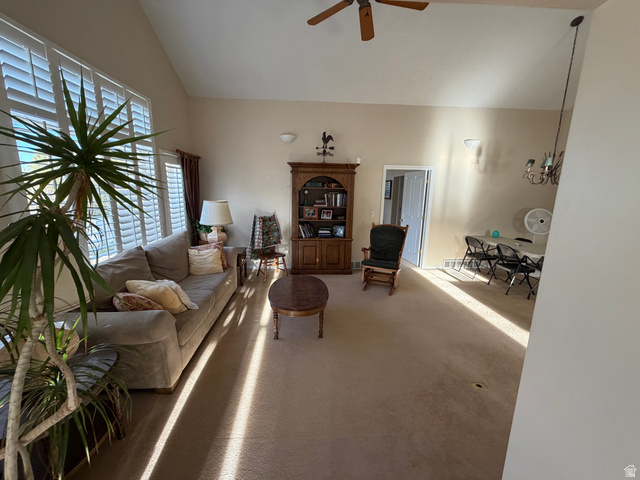 10000 North 6730th East Spring City, UT 84662 - Photo 6 of 31 Vaulted ceilings define this spacious living area, featuring plantation shutters on large windows