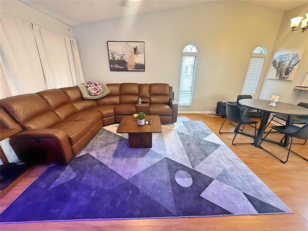 8007 Northwest 71st Court Tamarac, FL 33321 - Photo 5 of 9 a living room with furniture and a wooden floor