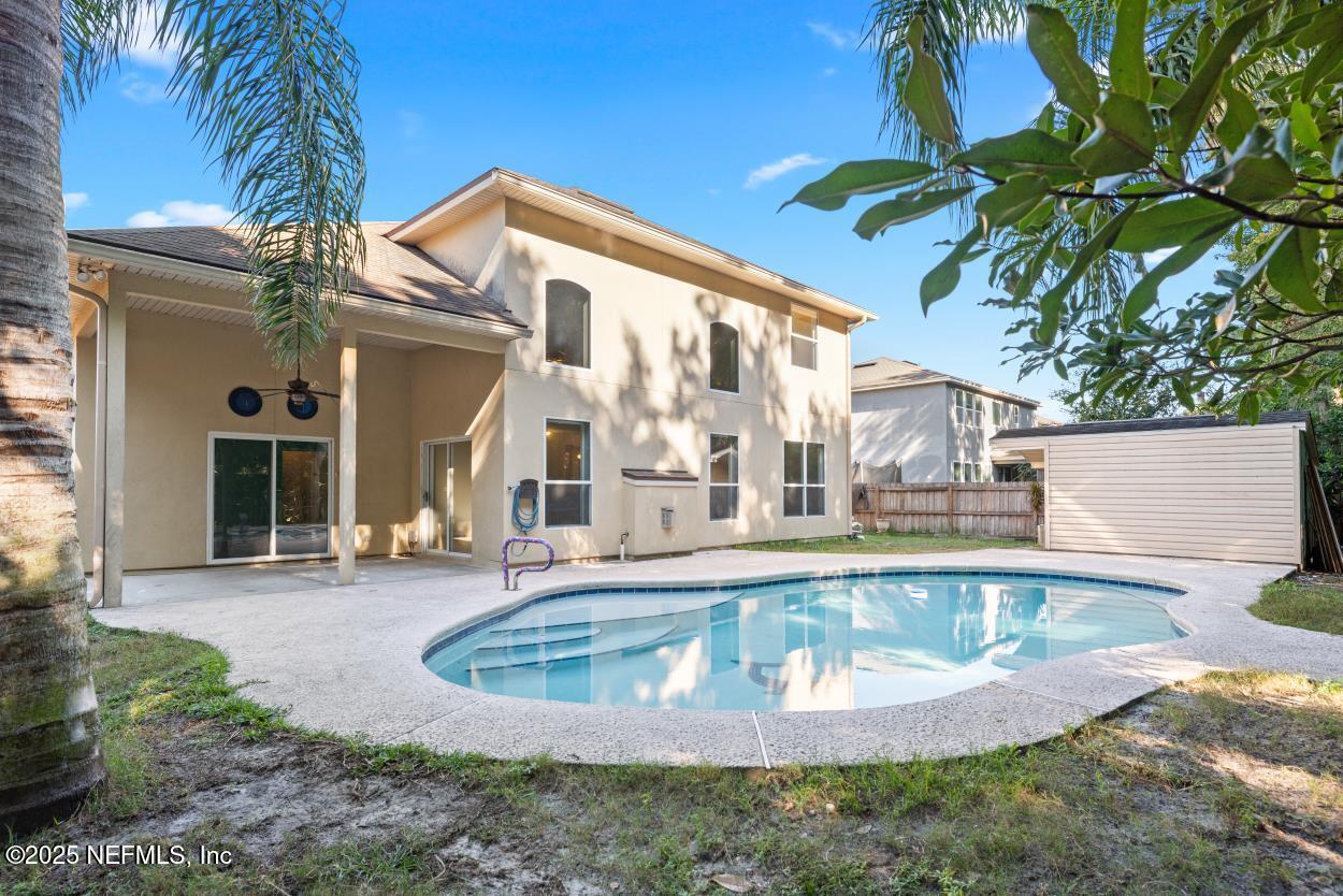 700 Reflection Cove Road East Jacksonville, FL 32218 - Photo 21 of 62 a view of a house with a swimming pool