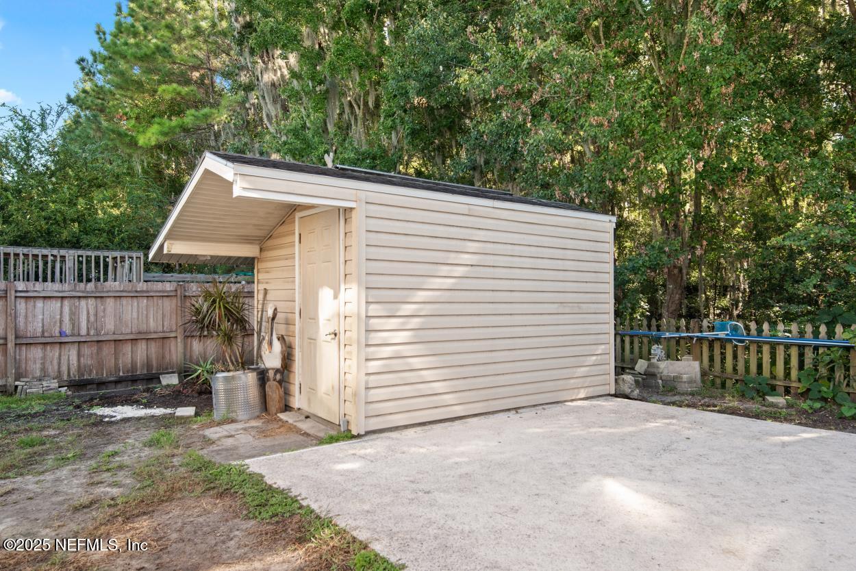 700 Reflection Cove Road East Jacksonville, FL 32218 - Photo 22 of 62 a view of a house with a backyard