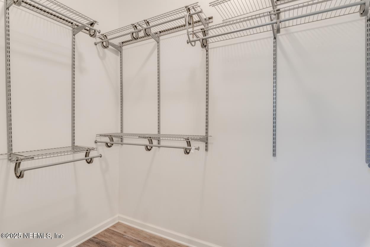 700 Reflection Cove Road East Jacksonville, FL 32218 - Photo 31 of 62 a view of a room with rack on the wall