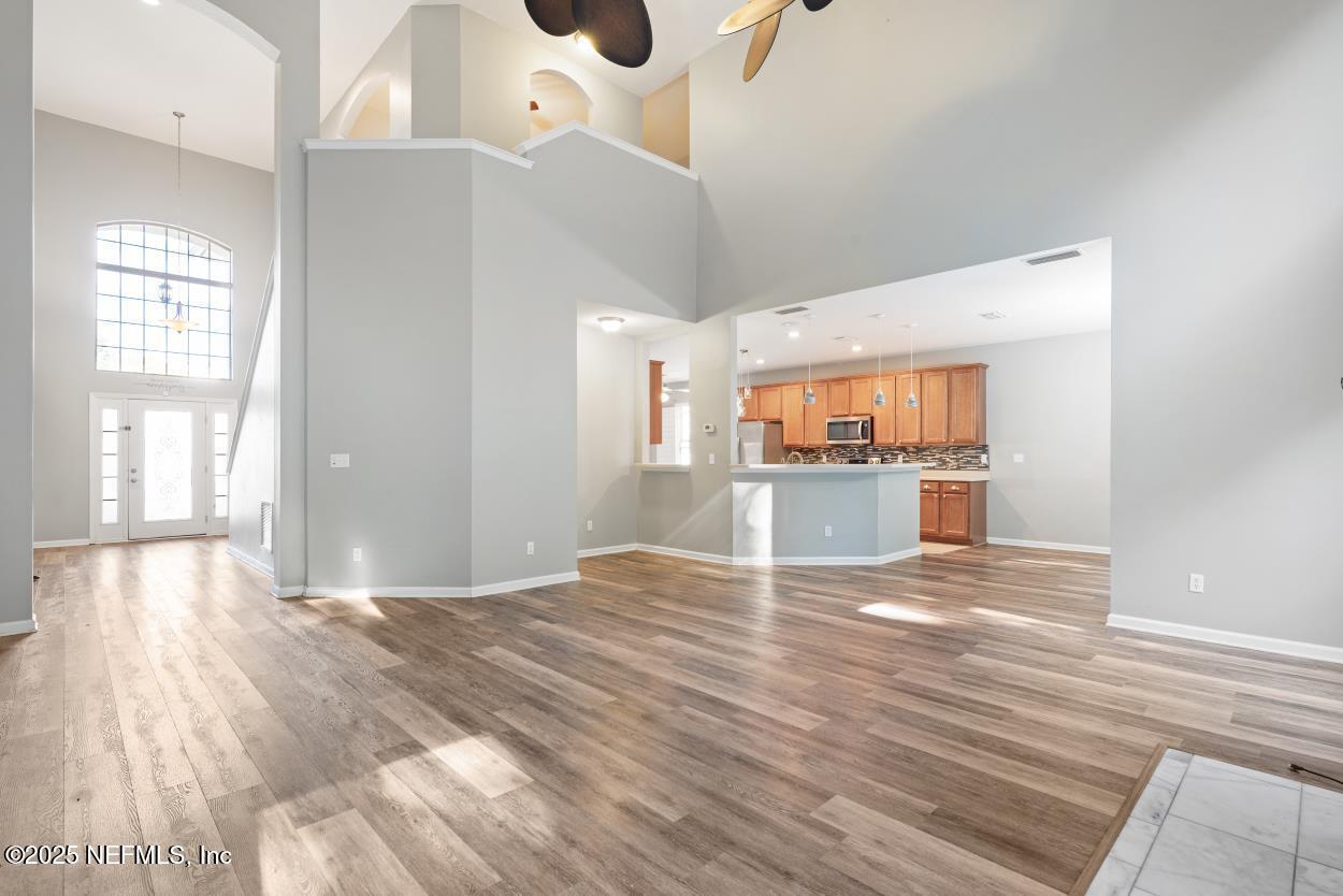 700 Reflection Cove Road East Jacksonville, FL 32218 - Photo 61 of 62 a view of empty room with wooden floor and windows