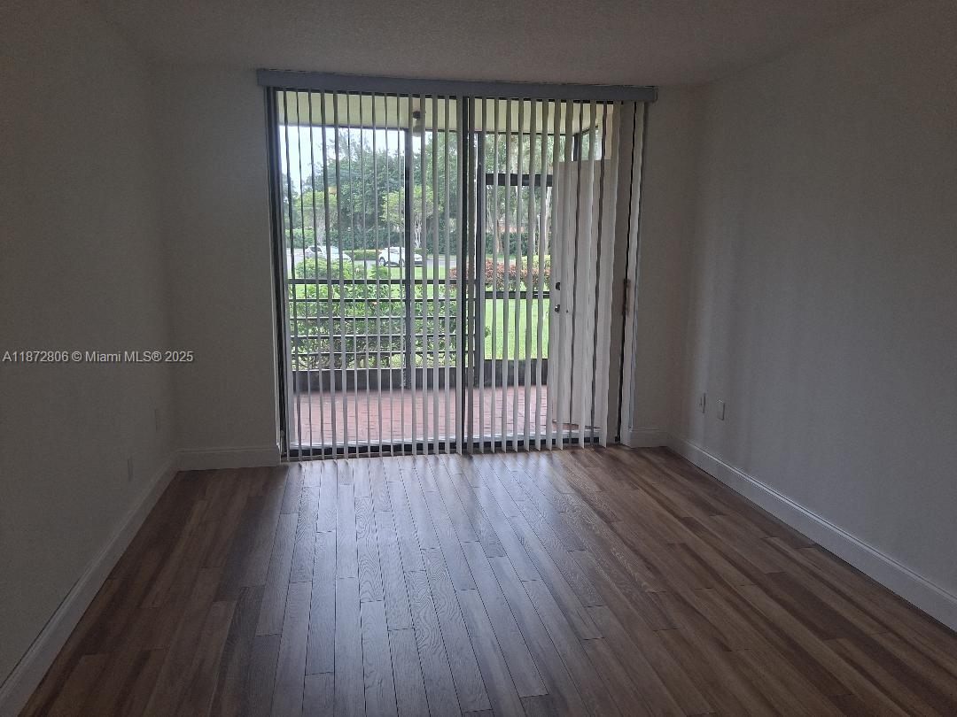 1000 St Charles Place, Unit L20 Pembroke Pines, FL 33026 - Photo 12 of 23 wooden floor in a room
