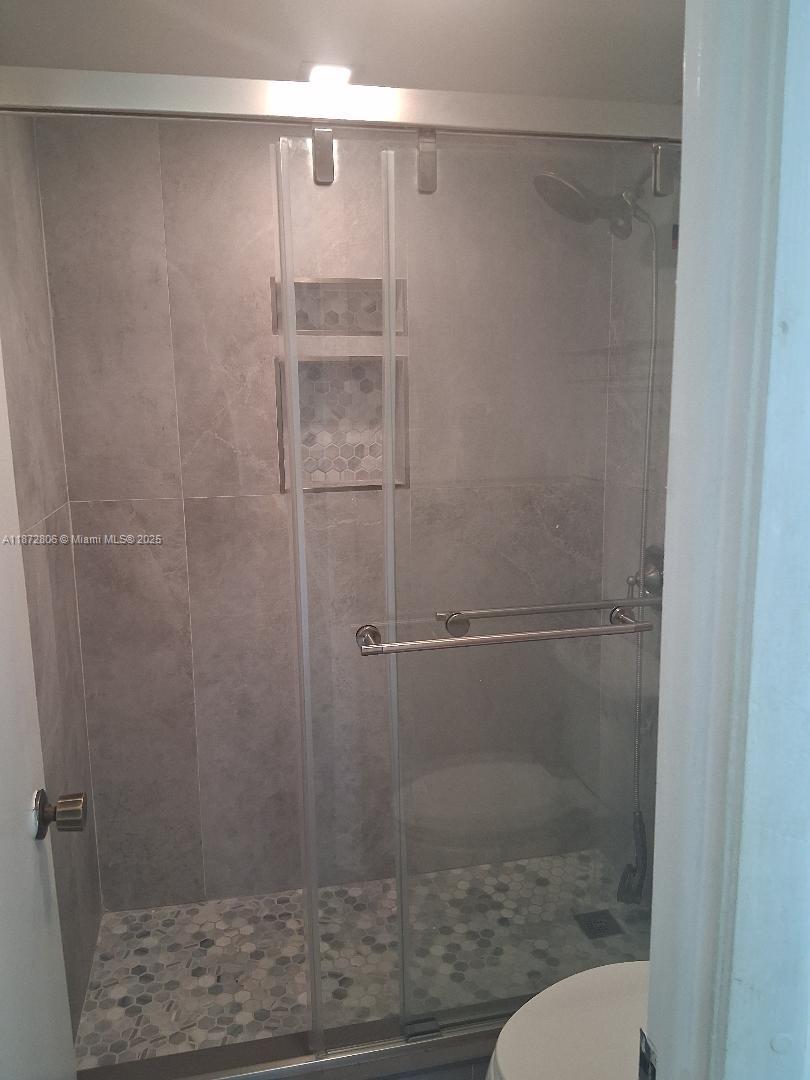 1000 St Charles Place, Unit L20 Pembroke Pines, FL 33026 - Photo 15 of 23 a bathroom with a shower