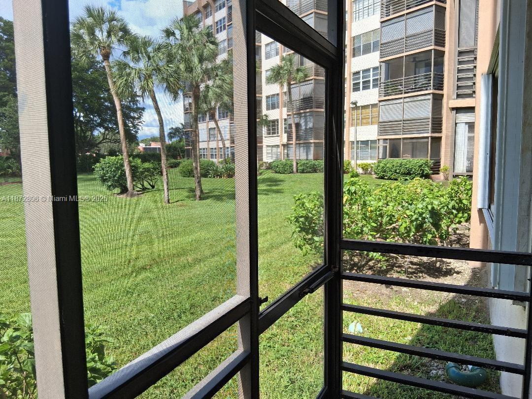 1000 St Charles Place, Unit L20 Pembroke Pines, FL 33026 - Photo 21 of 23 a view of backyard from deck