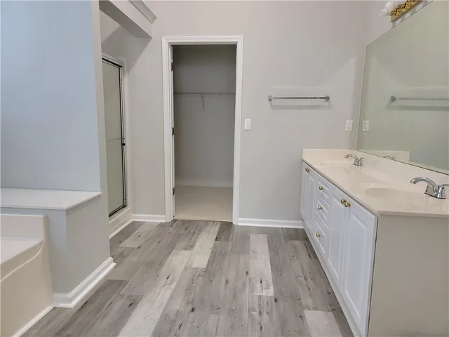a view of a kitchen from a hallway